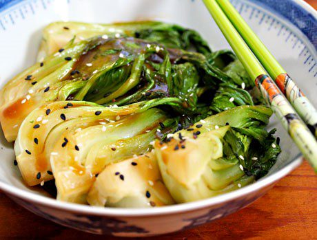 sesame bok choy in bowl with chop sticks